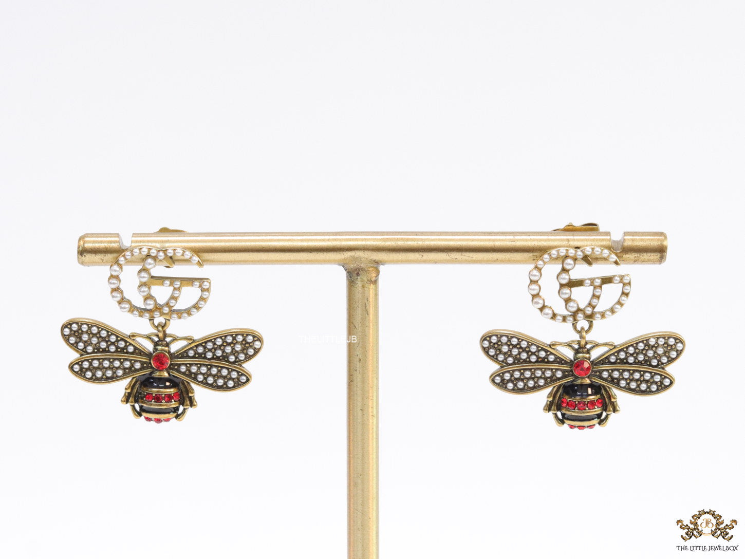 Gold plated twin G cz earrings with honey bee motif drop