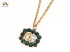 Rustic double g with green stones