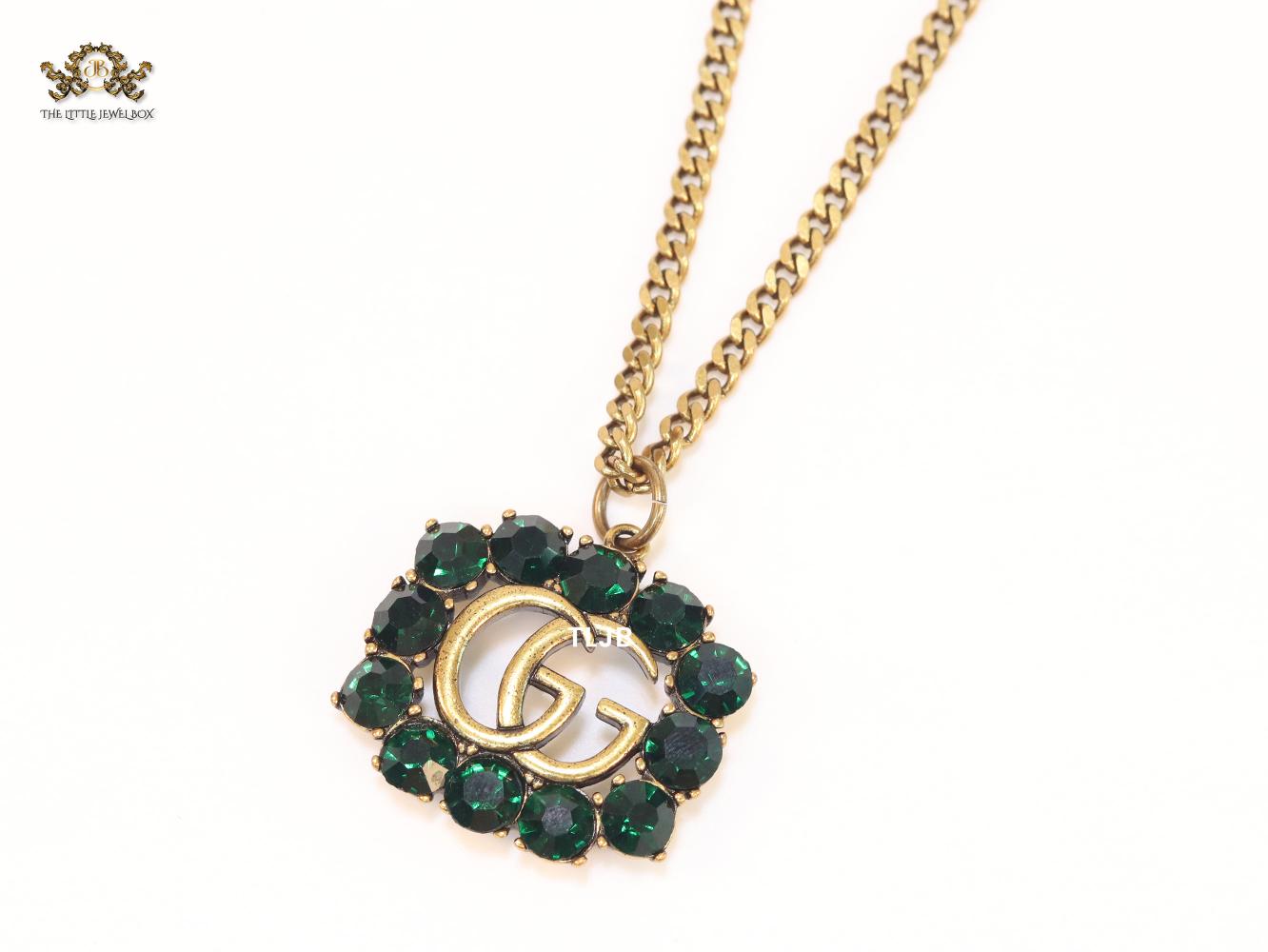 Rustic double g with green stones