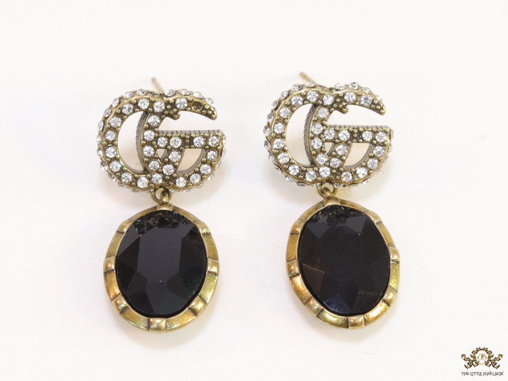 Rustic double G earings with oval black drop