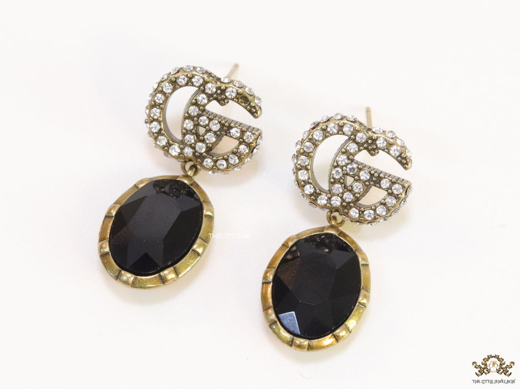 Rustic double G earings with oval black drop