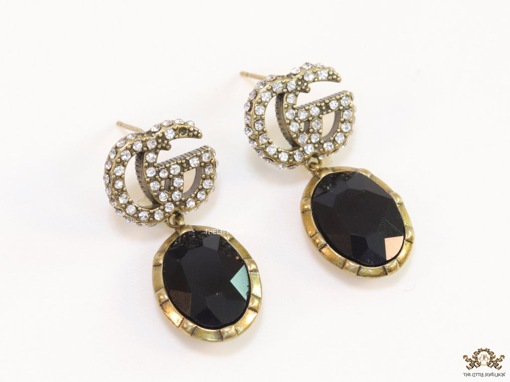 Rustic double G earings with oval black drop