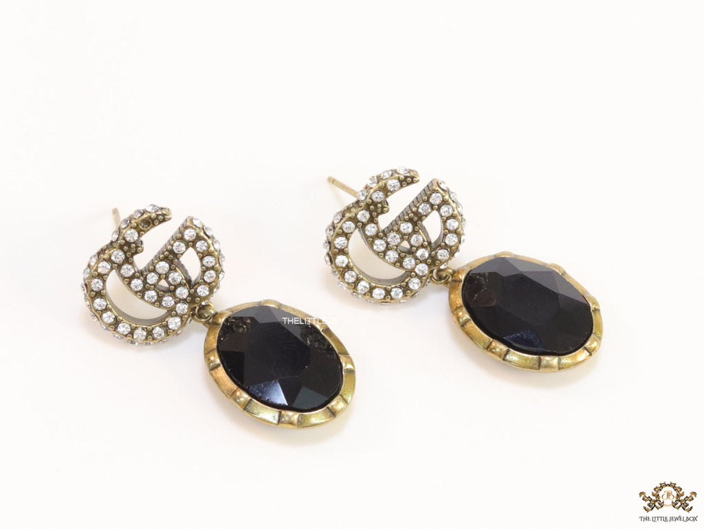 Rustic double G earings with oval black drop