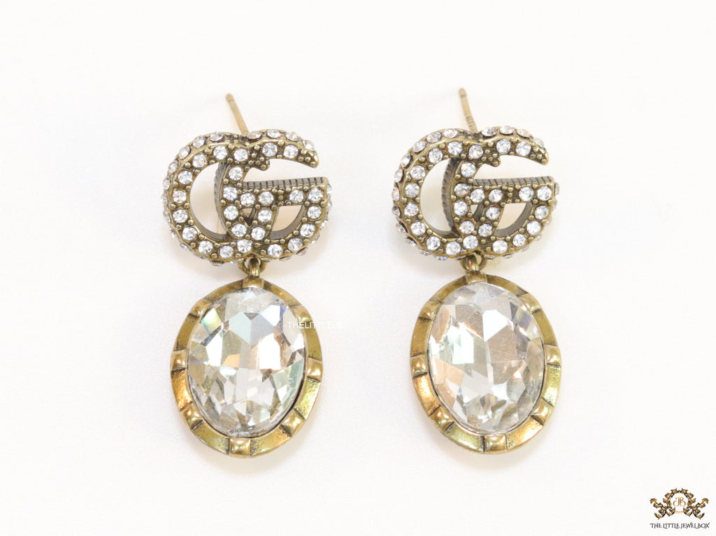 Rustic double G earrings with white drop