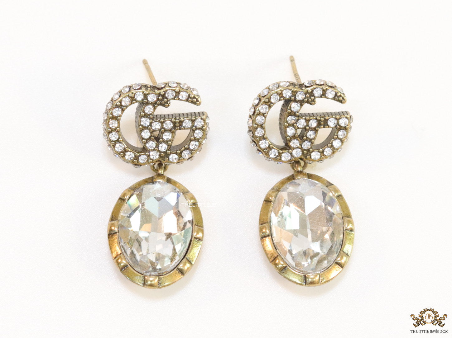 Rustic double G earrings with white drop