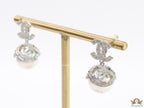 Platinum plated twin C earrings in cz with cz capped pearl drop