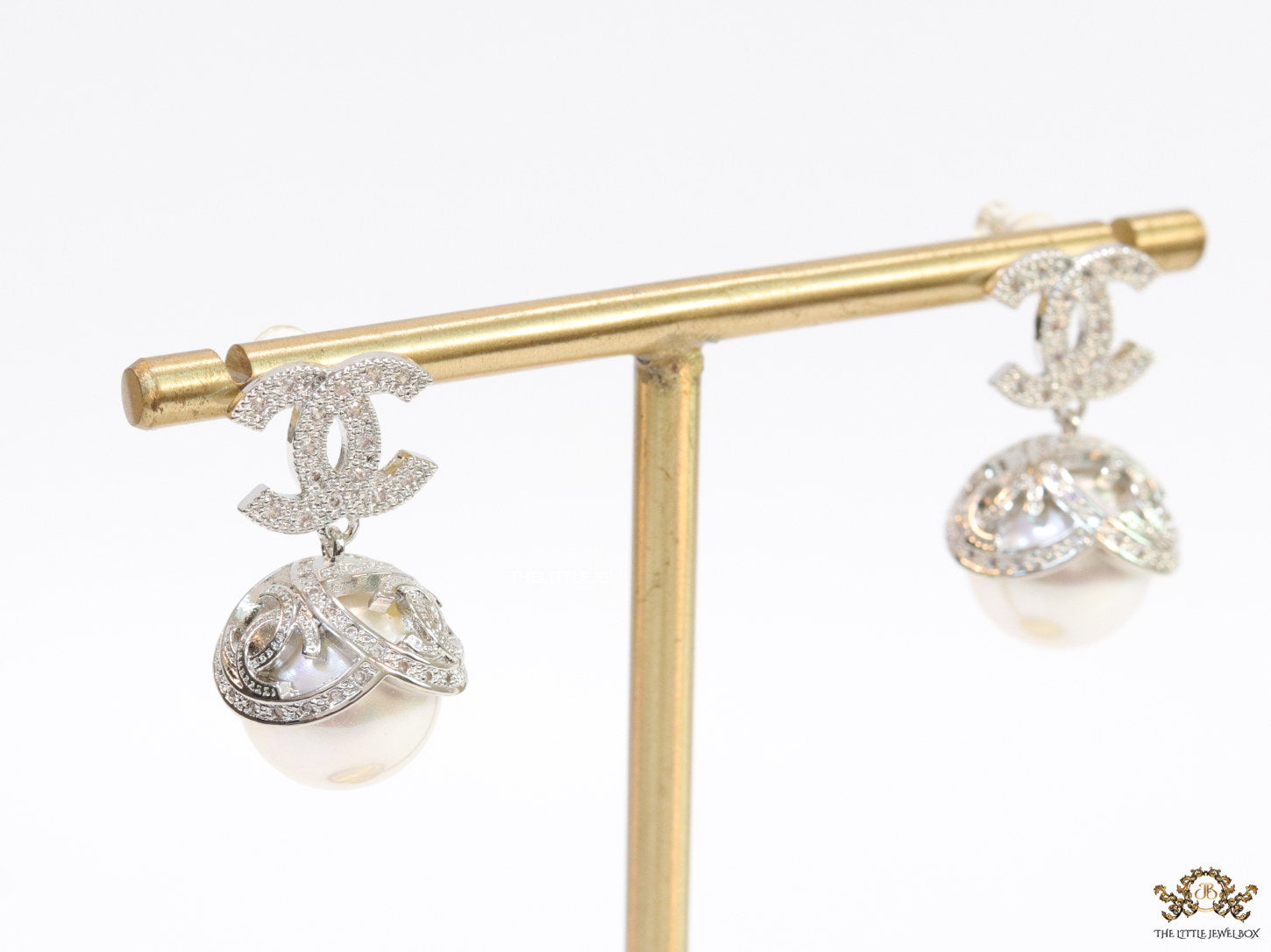 Platinum plated twin C earrings in cz with cz capped pearl drop
