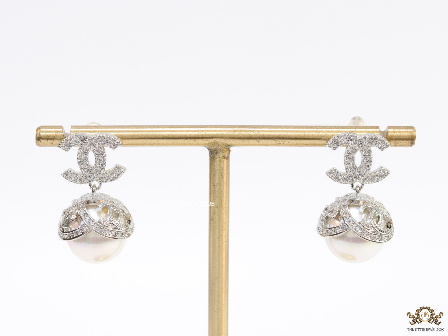 Platinum plated twin C earrings in cz with cz capped pearl drop