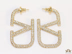 Open golden alphabet earrings with cz