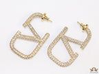 Open golden alphabet earrings with cz