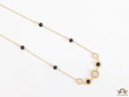 Golden chain necklace with black beads and golden alphabet discs, cz and more