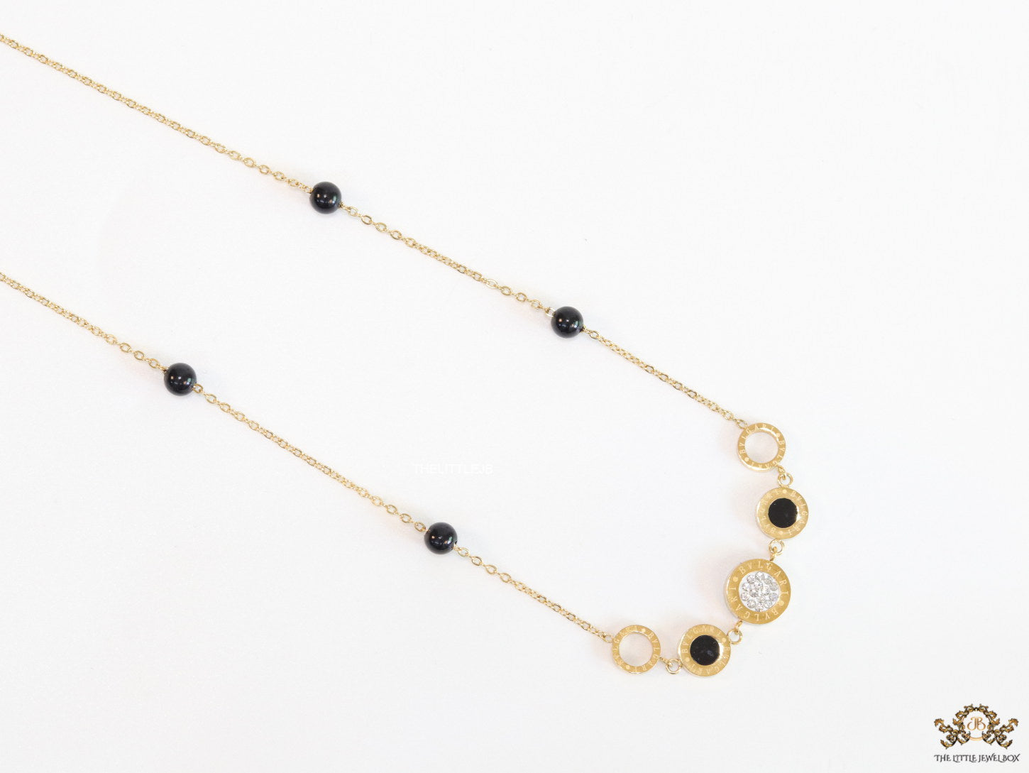 Golden chain necklace with black beads and golden alphabet discs, cz and more