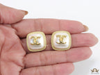 Twin C motif square studs in golden and MOP finish