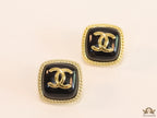 Twin C motif square studs in golden and black finish