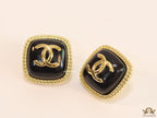 Twin C motif square studs in golden and black finish
