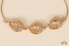 Gold plated sling bracelet with snake motifs