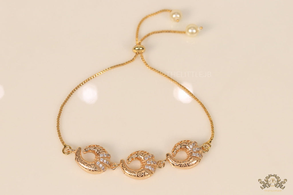Gold plated sling bracelet with snake motifs