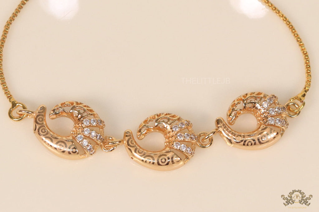 Gold plated sling bracelet with snake motifs