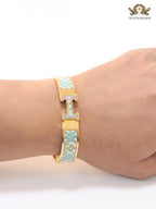 Alphabet H baby pink and blue motifs on white bracelet
