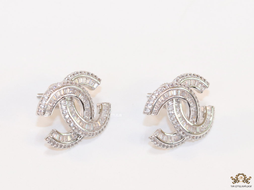 Platinum plated cz studs in twin C motif