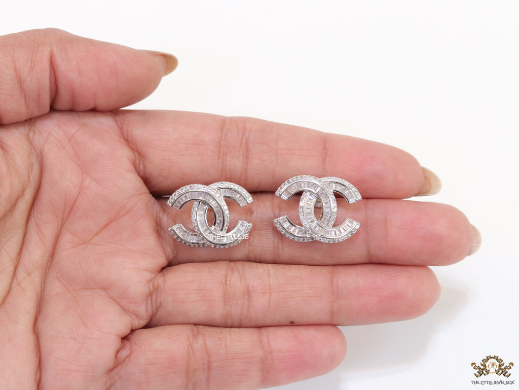 Platinum plated cz studs in twin C motif