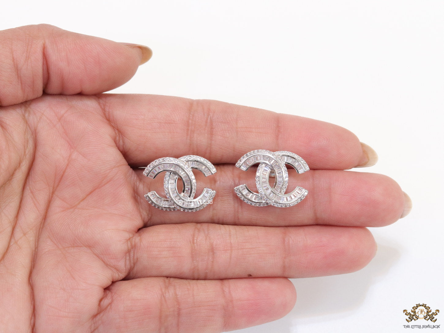 Platinum plated cz studs in twin C motif