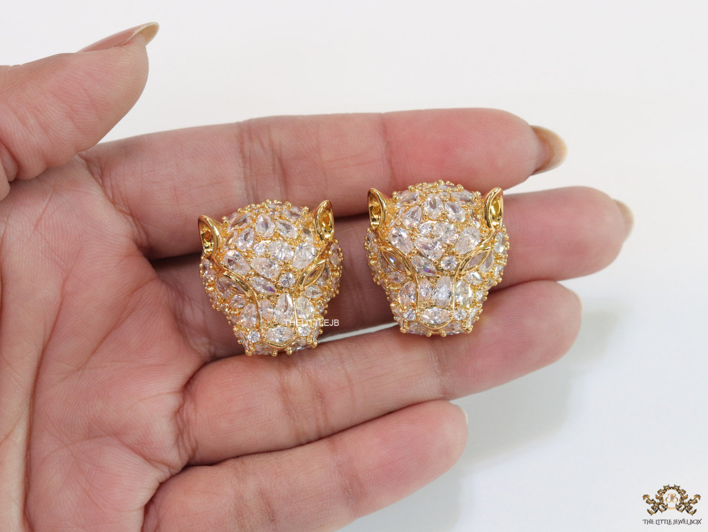 Panther head stud earrings in gold plating and cz