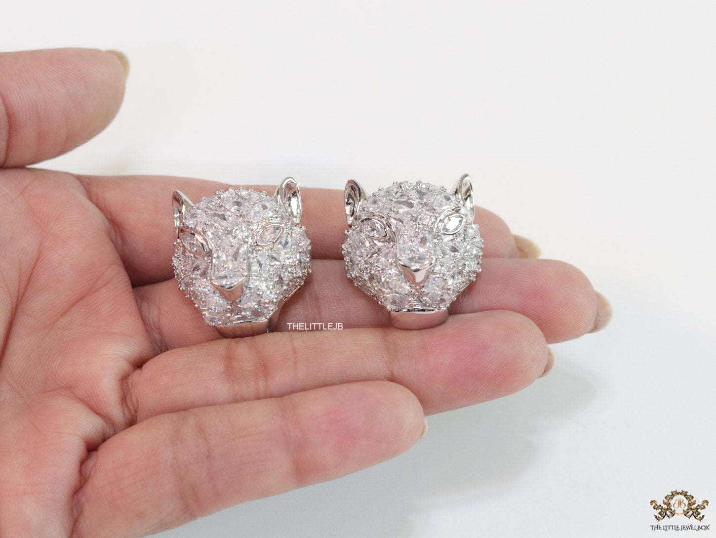 Panther head stud earrings in platinum and cz