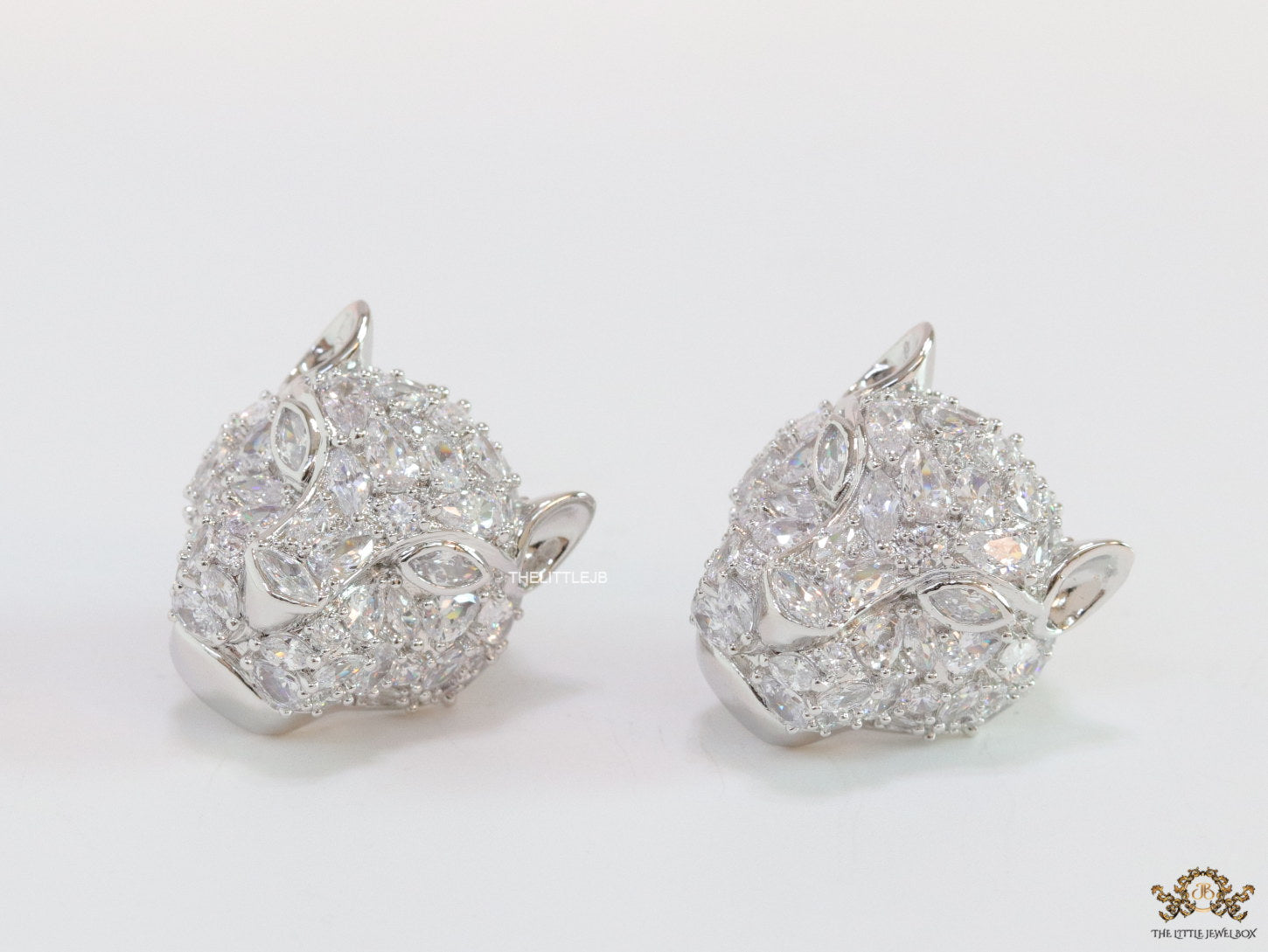 Panther head stud earrings in platinum and cz