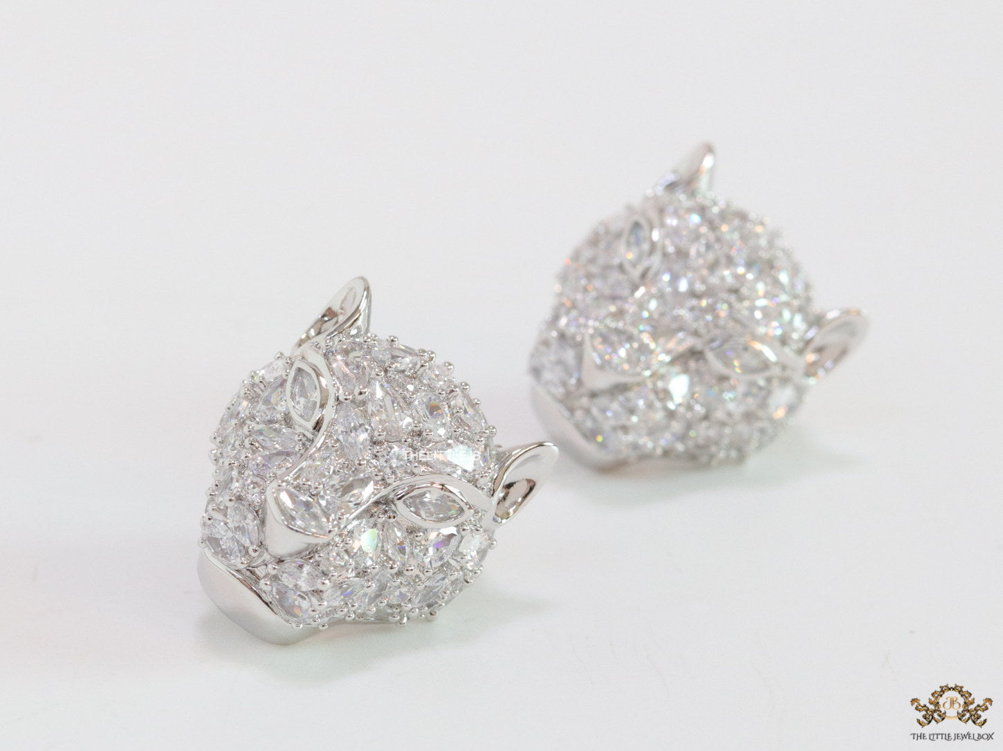 Panther head stud earrings in platinum and cz