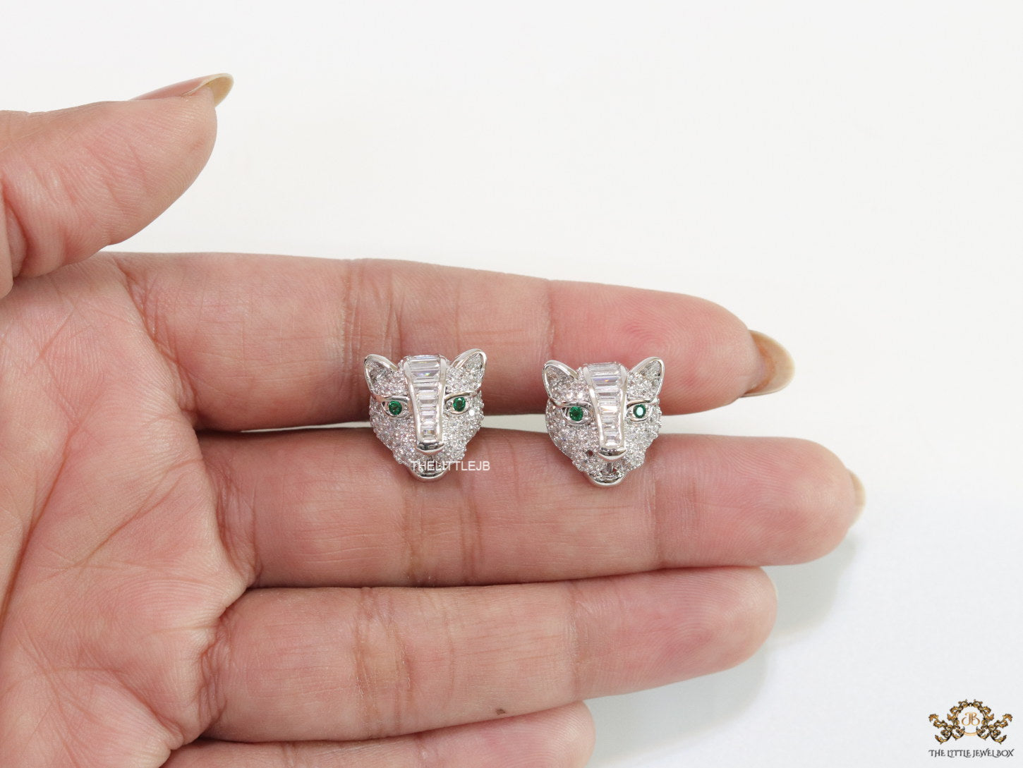Cz panther stud earrings in platinum finish and emerald green eyes