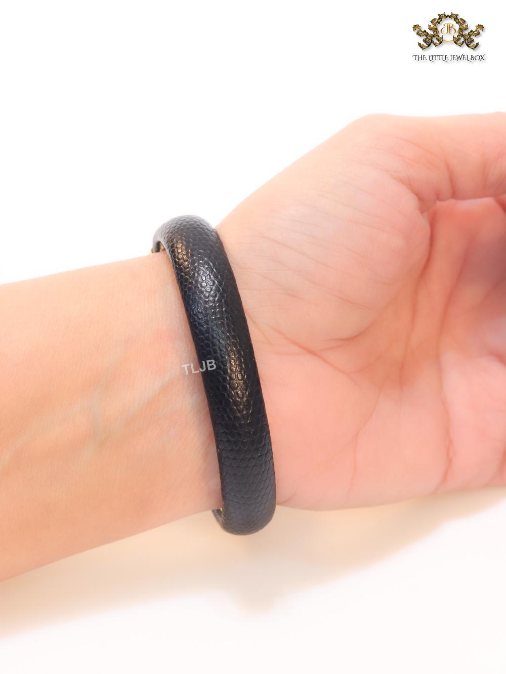 Two snake head black leather bracelet