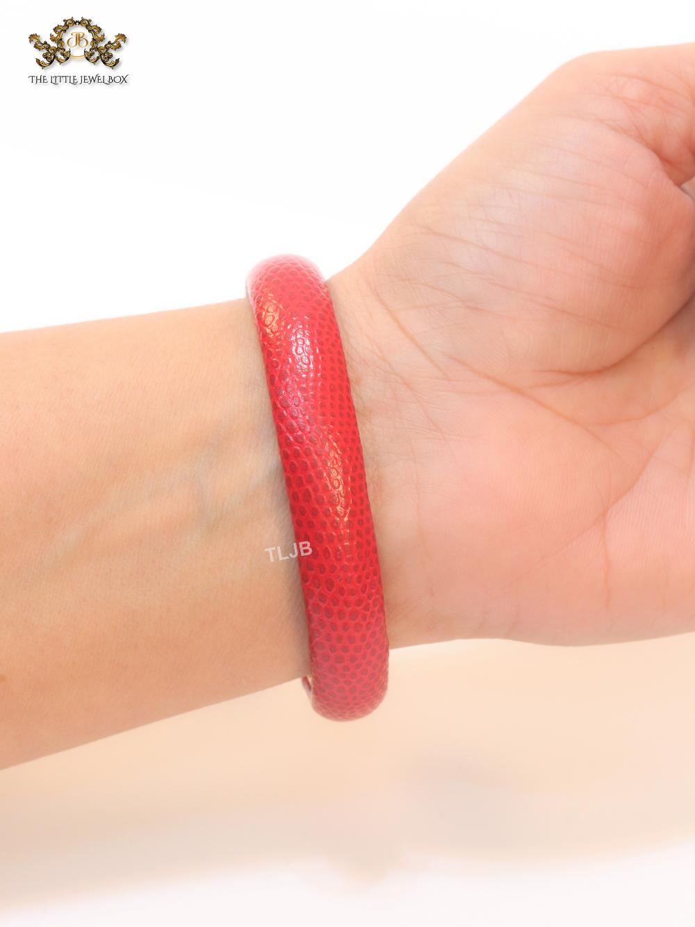 Two snake head red leather bracelet