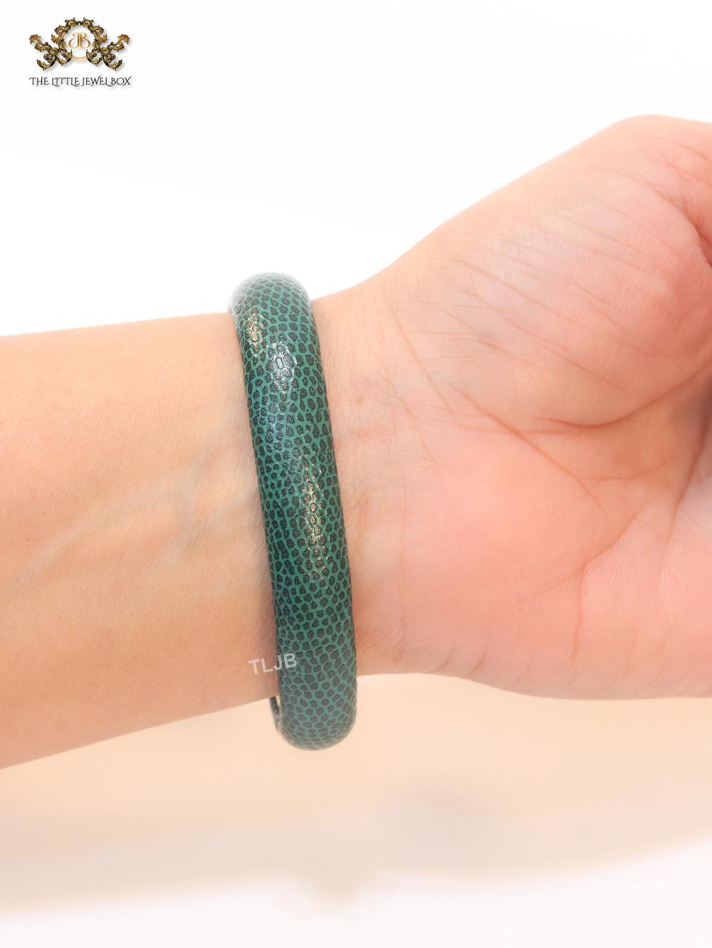 Two snake head green leather bracelet