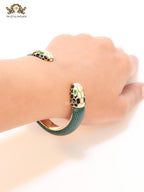 Two snake head green leather bracelet