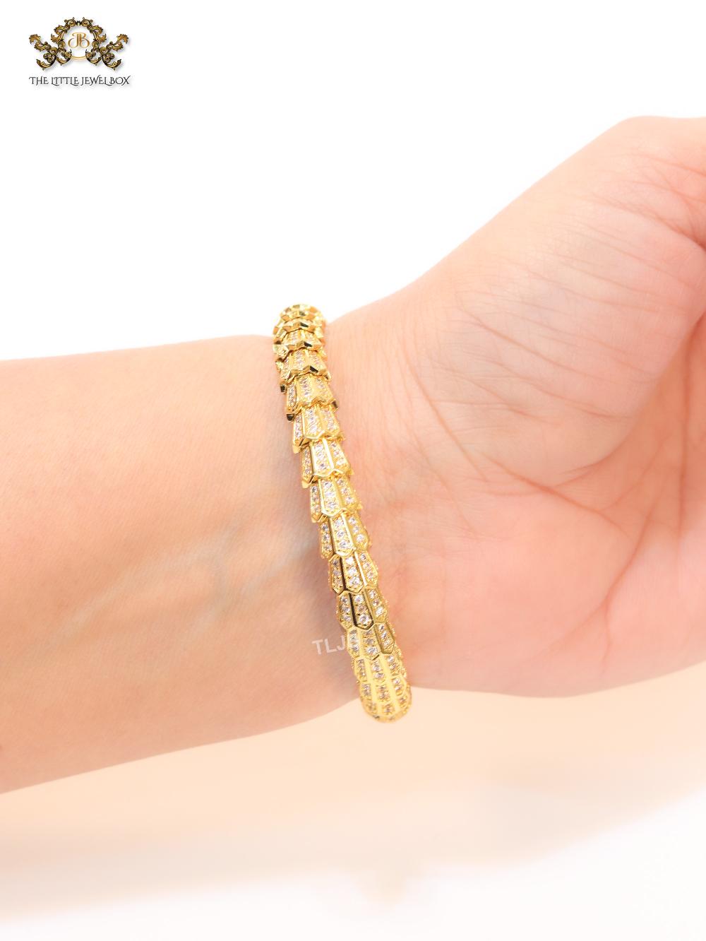 Gold serpentine and cz bracelet
