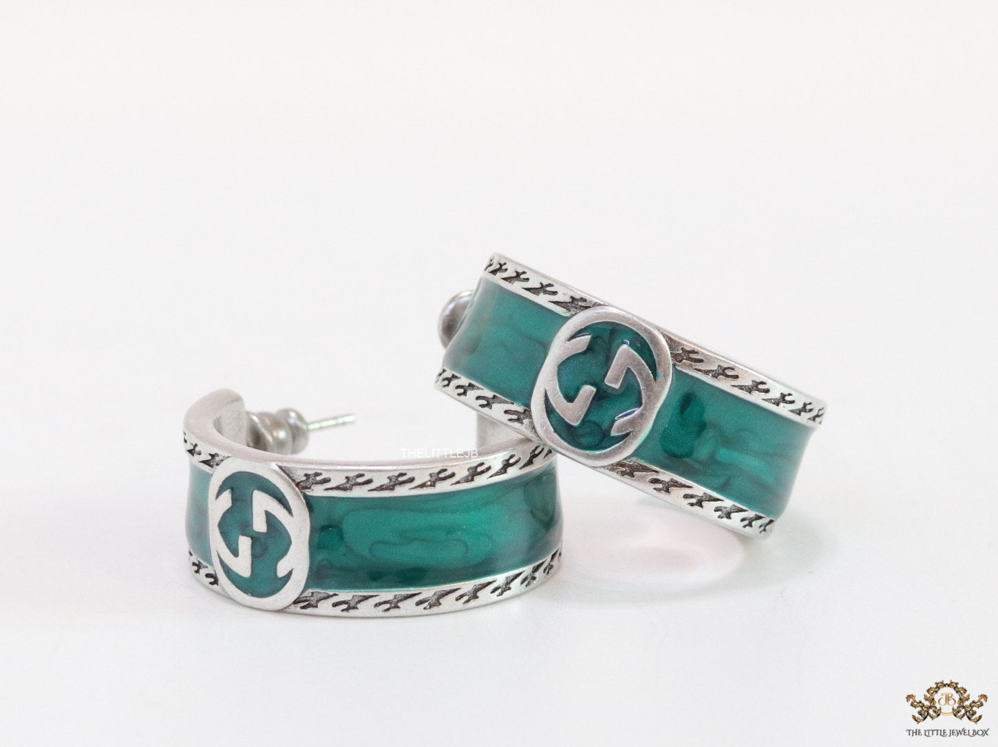 Blue green platinum studs with twin G motif