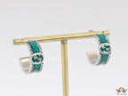 Blue green platinum studs with twin G motif