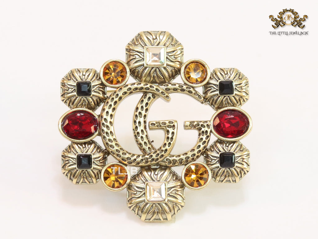 Double G embossed rustic brooch with multi coloured stones