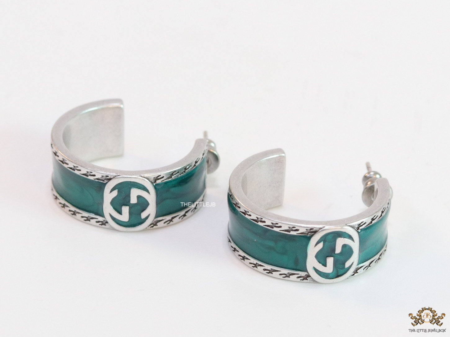 Blue green platinum studs with twin G motif