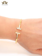 Alphabet T MOP and gold sleek bracelet