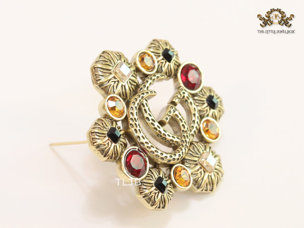 Double G embossed rustic brooch with multi coloured stones