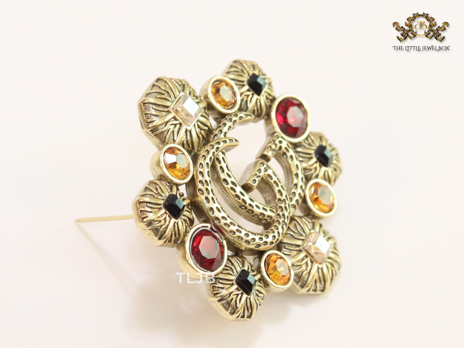 Double G embossed rustic brooch with multi coloured stones