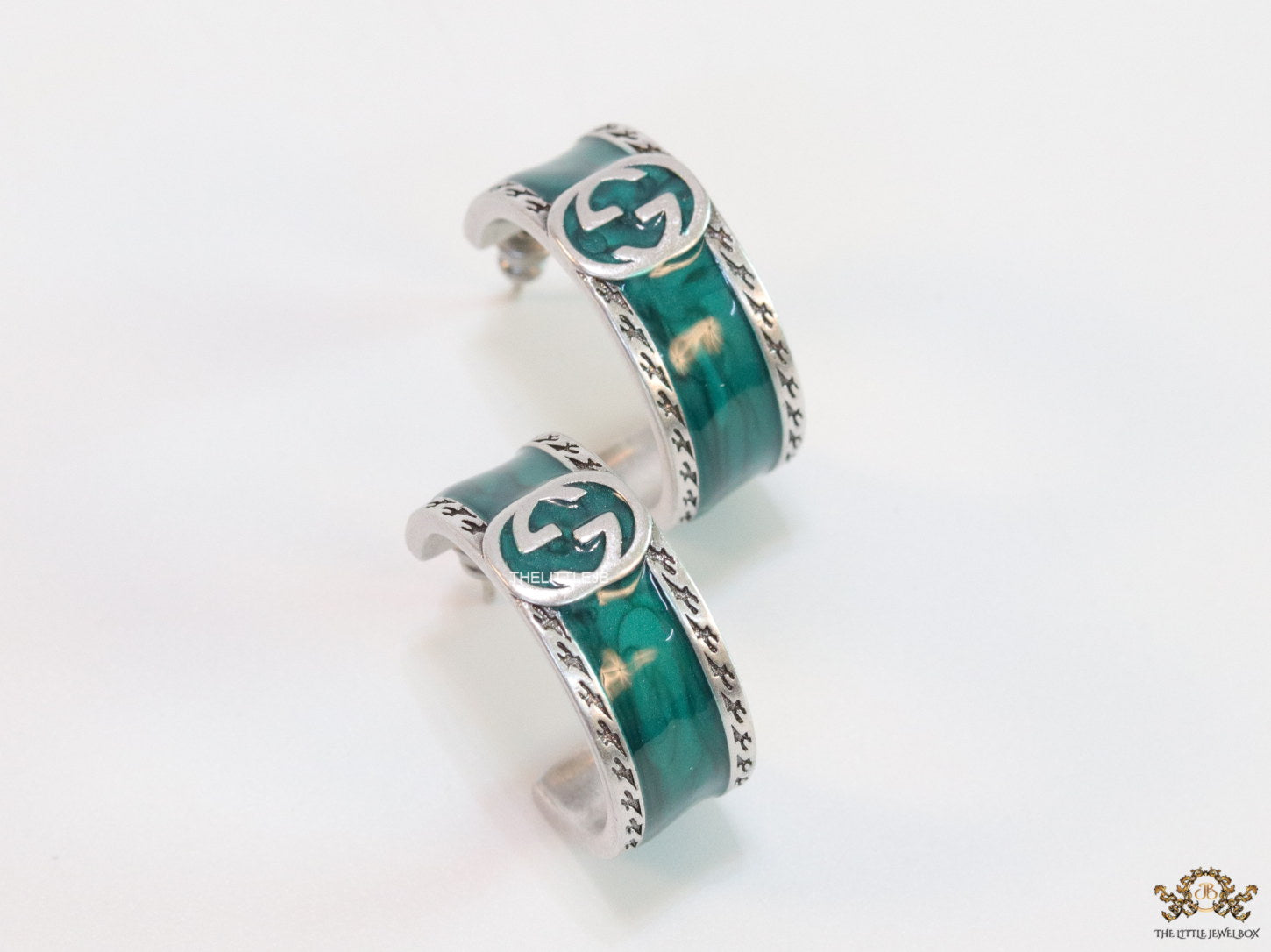 Blue green platinum studs with twin G motif