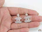 Platinum plated cz dangle earrings with twin C motif