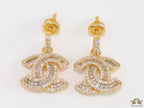 Gold plated cz dangle earrings with twin C motif