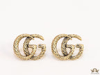 Double G motif studs with woven basket texture in antique gold finish