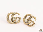Double G motif studs with woven basket texture in antique gold finish