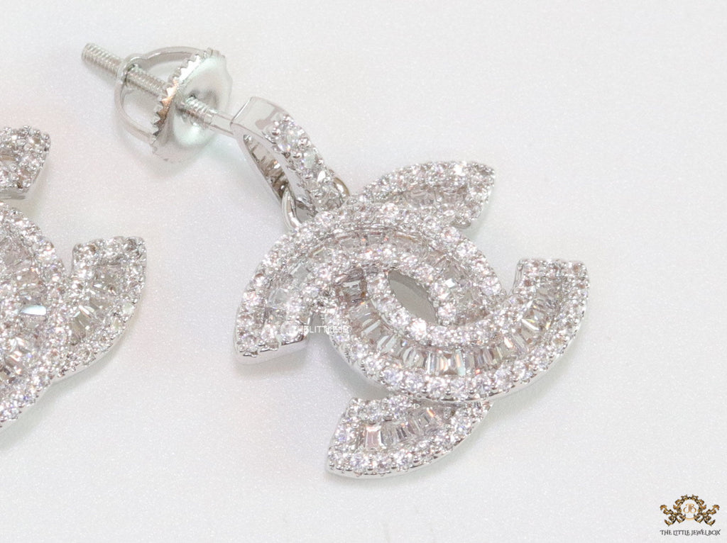 Platinum plated cz dangle earrings with twin C motif