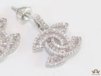 Platinum plated cz dangle earrings with twin C motif